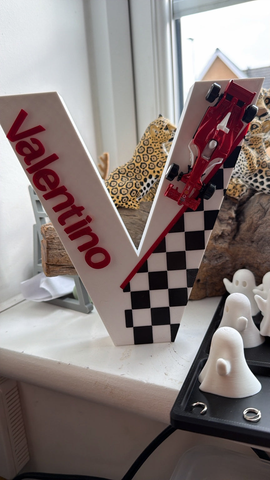 Personalised 3D printed letter V with Valentino name, red racing car and chequered decoration