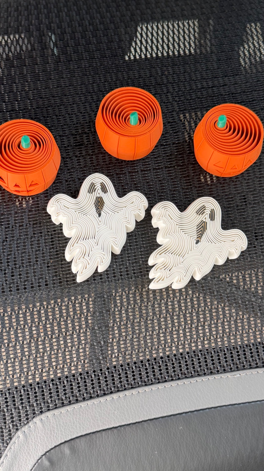 Orange pumpkin and white ghost fidgets with nested moving sections