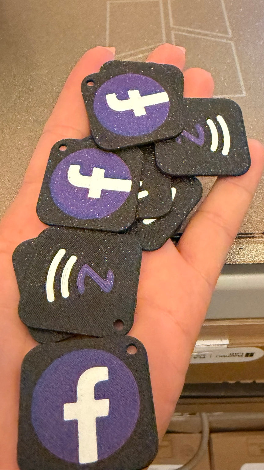 Black and purple 3D printed Facebook and NFC tags