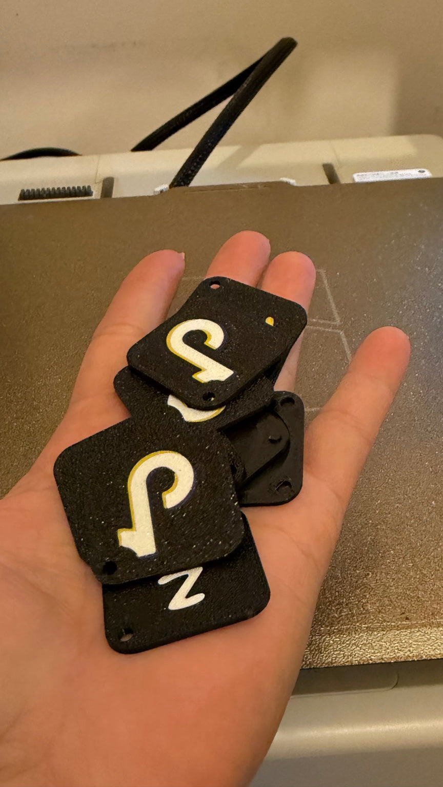Black 3D printed TikTok and NFC tags
