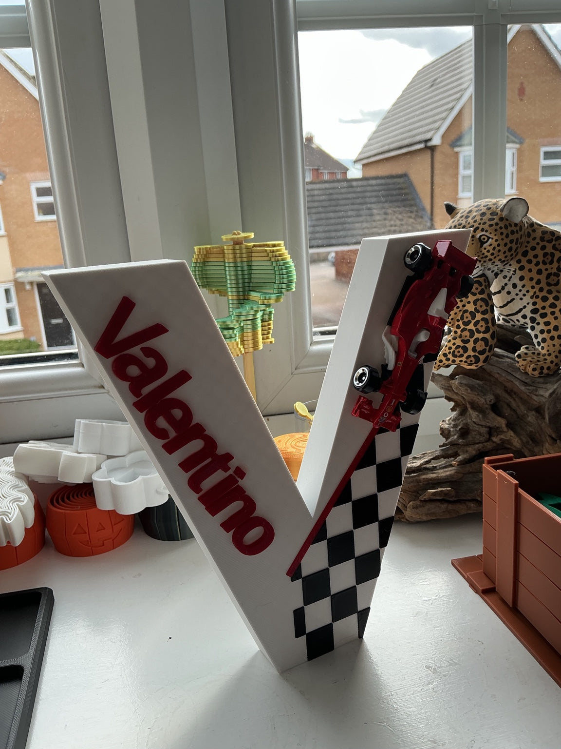 Custom name letter V with racing-themed decoration